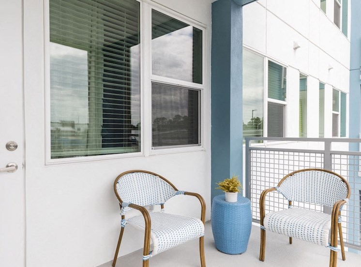 balcony with model patio set at Residences at The Green in Lakewood Ranch